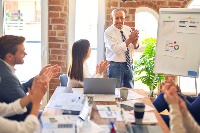 Group,Of,Business,Workers,Working,Together,In,A,Meeting.,One